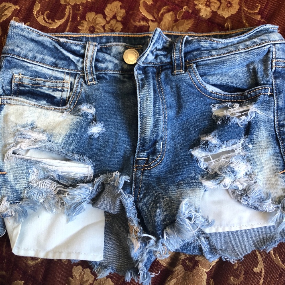 Ripped blue jean shorts